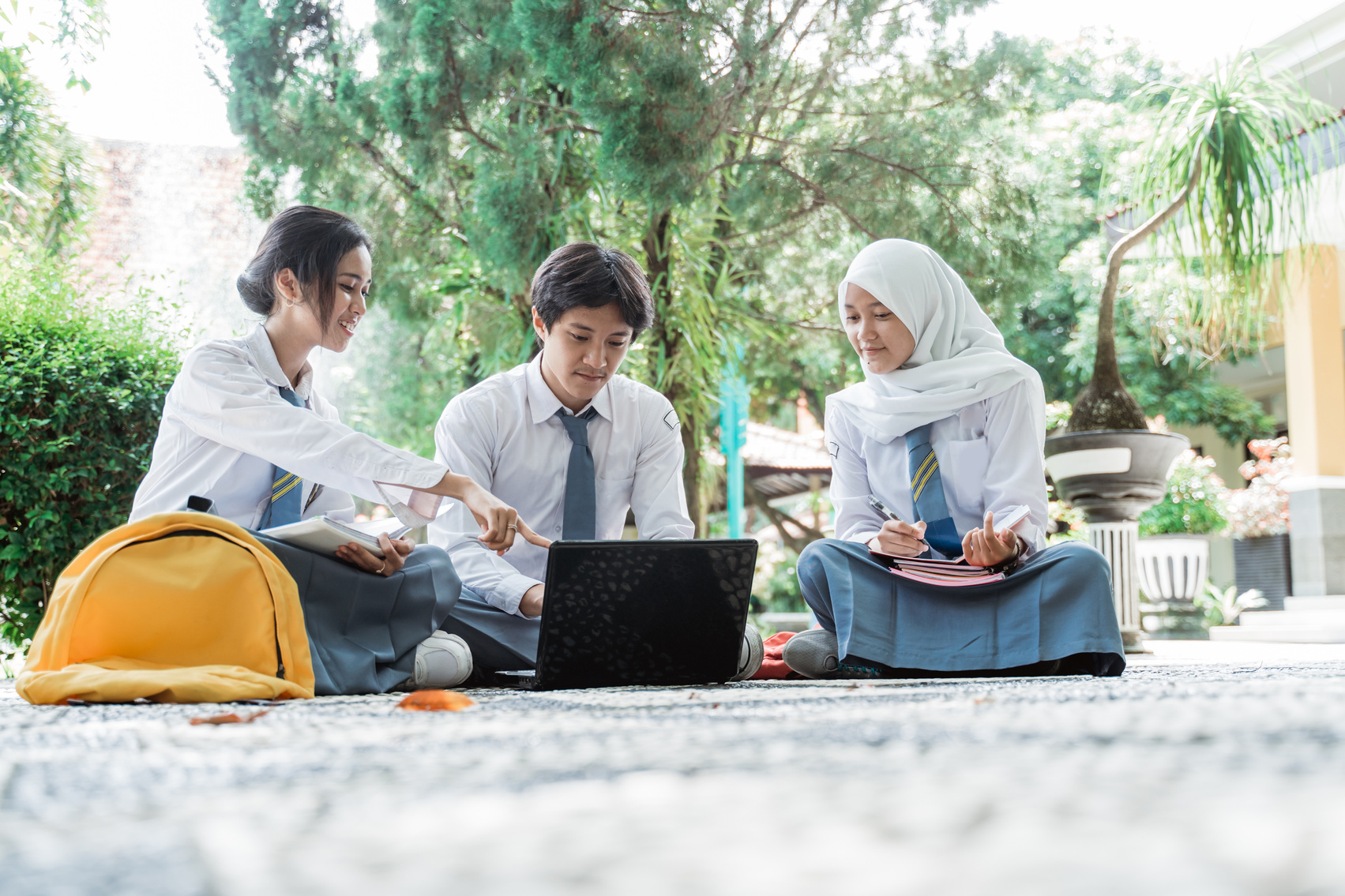 Study Group of High School Children Wearing Uniforms When Learning to Use a Laptop Computer